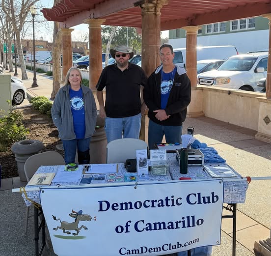 farmersmarket Farmer's Market booth with 3 volunteers